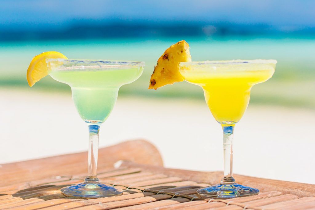 Two tasty cocktails on tropical white beach